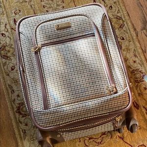 London Fog carryon size rolling suitcase.